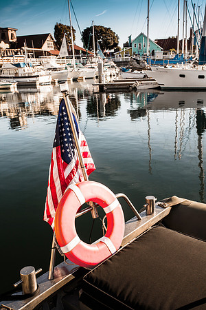 Yacht with American flag At The Pier