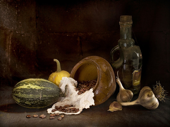 Still life with garlic, squash and strewed beans