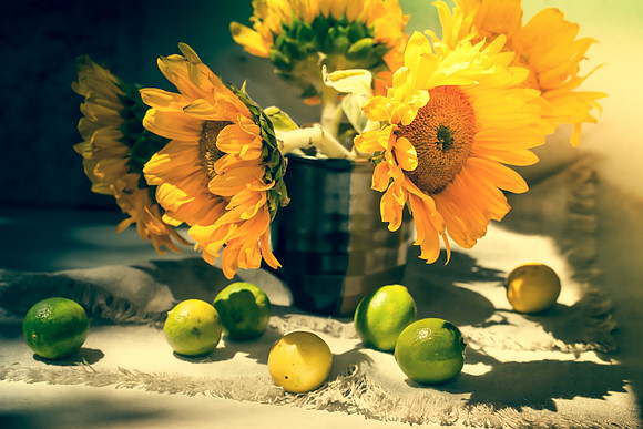 Still life with sunflowers and lemons